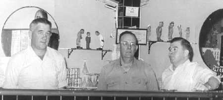 Three workers, at the Bar