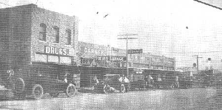 The Second Henderson Drug Store, first building on the left.
